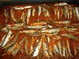 Roast anchovies with tomato and olive oil